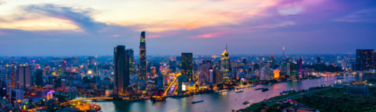 Aerial view of Ho Chi Minh City skyline and skyscrapers in center of heart business at Ho Chi Minh City downtown. Panorama of cityscape on Saigon river in Ho Chi Minh City at Vietnam at sunset scene