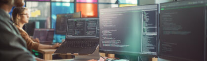 Professional Male Data Scientist Writing Code on Desktop Computer in Stylish Office Space. Caucasian Man Using Software to Analyze Information From Internet and Improve Performance.